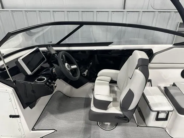 Slide: The Image of 2025 Yamaha Boats AR250 interior with modern dashboard and comfortable seating. - 16