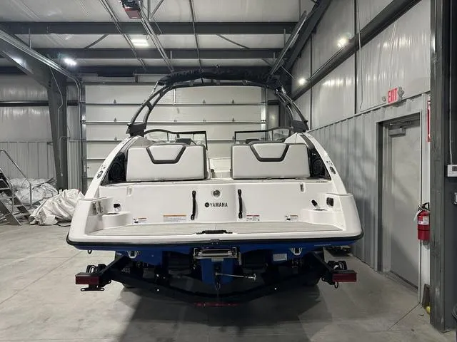 Slide: The Image of 2025 Yamaha Boats AR250 in a warehouse, rear view. - 6