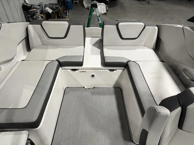 Slide: The Image of 2025 Yamaha Boats AR250 interior seating with modern design and gray accents. - 9