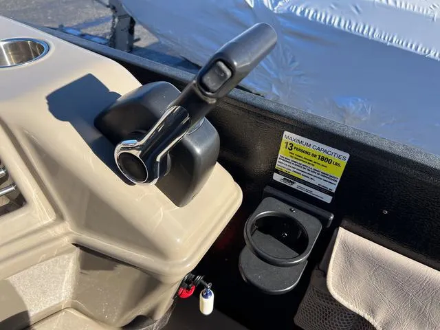 Slide: The Image of Premier Solaris 250 RF 2012 boat control panel with throttle and cup holder. - 18