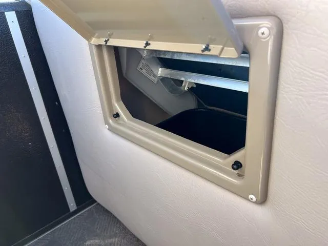 Slide: The Image of Open storage compartment in 2012 Premier Solaris 250 RF boat interior. - 20