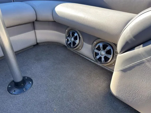 Slide: The Image of Premier Solaris 250 RF 2012 boat interior with speakers and cushioned seating. - 23