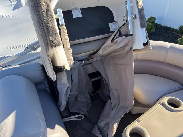 Slide: The Image of 2012 Premier Solaris 250 RF boat interior with gray seating and storage area. - 24