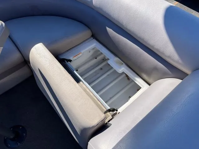Slide: The Image of Open storage compartment in 2012 Premier Solaris 250 RF boat seat. - 25