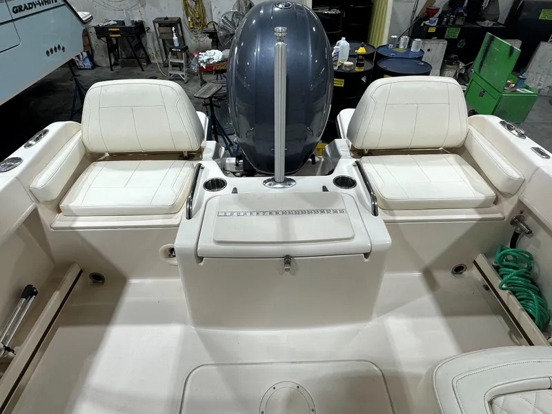 Slide: The Image of 2020 Grady-White 215 Freedom boat interior with seating and engine view. - 11