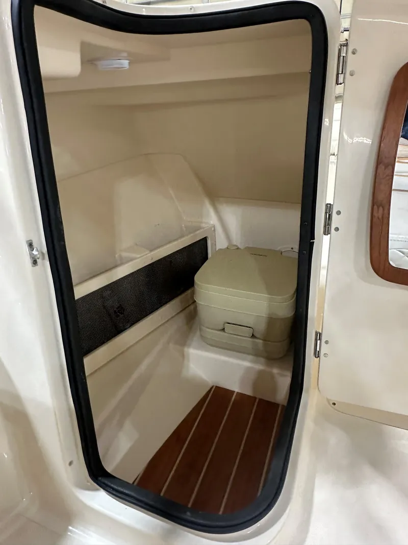 Slide: The Image of Interior cabin of 2020 Grady-White 215 Freedom boat with portable toilet. - 5
