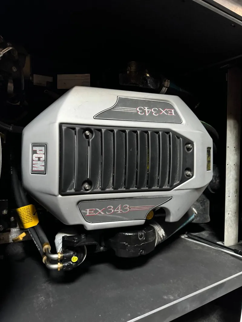 Slide: The Image of 2010 Nautique Sport Nautique 226 PCM EX343 engine close-up. - 13