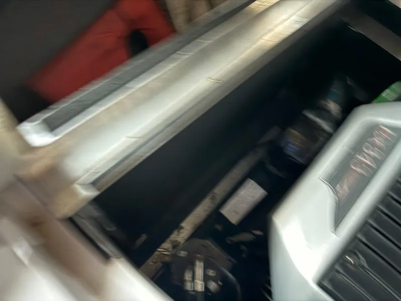 Slide: The Image of 2010 Nautique Sport Nautique 226 engine compartment with visible components. - 15