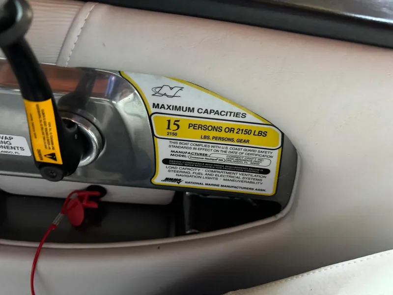 Slide: The Image of 2010 Nautique Sport Nautique 226 capacity label, 15 persons or 2150 lbs limit. - 17