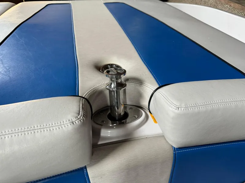 Slide: The Image of 2010 Nautique Sport Nautique 226 boat seat with blue and white upholstery. - 18