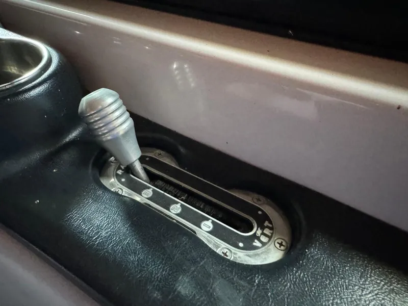 Slide: The Image of 2010 Nautique Sport Nautique 226 throttle lever in boat interior. - 21