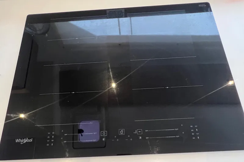 Slide: The Image of Interior of 2022 Fountaine Pajot Aura 51 yacht, featuring modern wood finishes and cozy layout. - 22