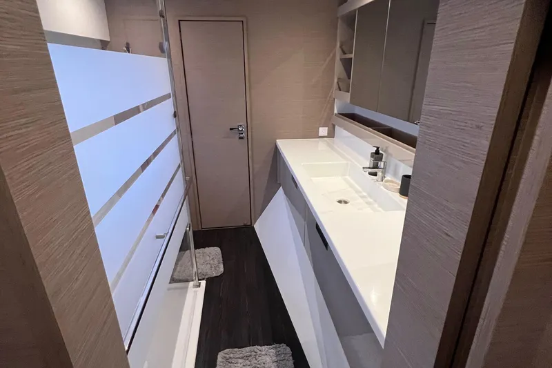 Slide: The Image of Cozy bedroom in 2022 Fountaine Pajot Aura 51 yacht with patterned bedding. - 42