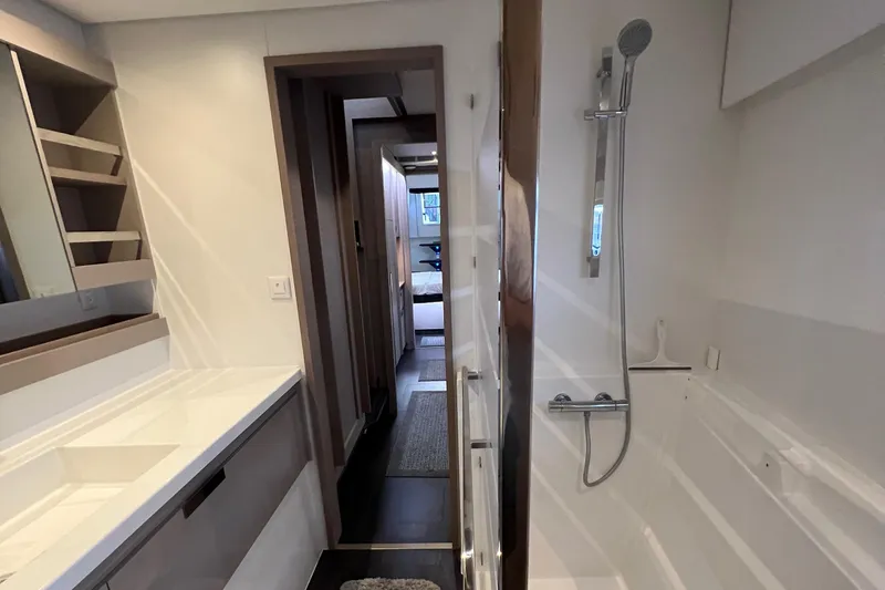 Slide: The Image of Outdoor grill on 2022 Fountaine Pajot Aura 51 yacht, docked with Yamaha motor nearby. - 43