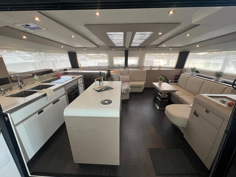 Slide: The Image of Modern interior of 2022 Fountaine Pajot Aura 51 yacht with sleek cabinetry and seating. - 13