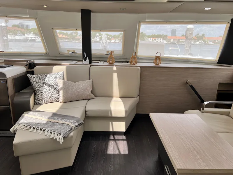 Slide: The Image of Luxurious cabin interior of 2022 Fountaine Pajot Aura 51 yacht, featuring modern design and cozy bedding. - 15