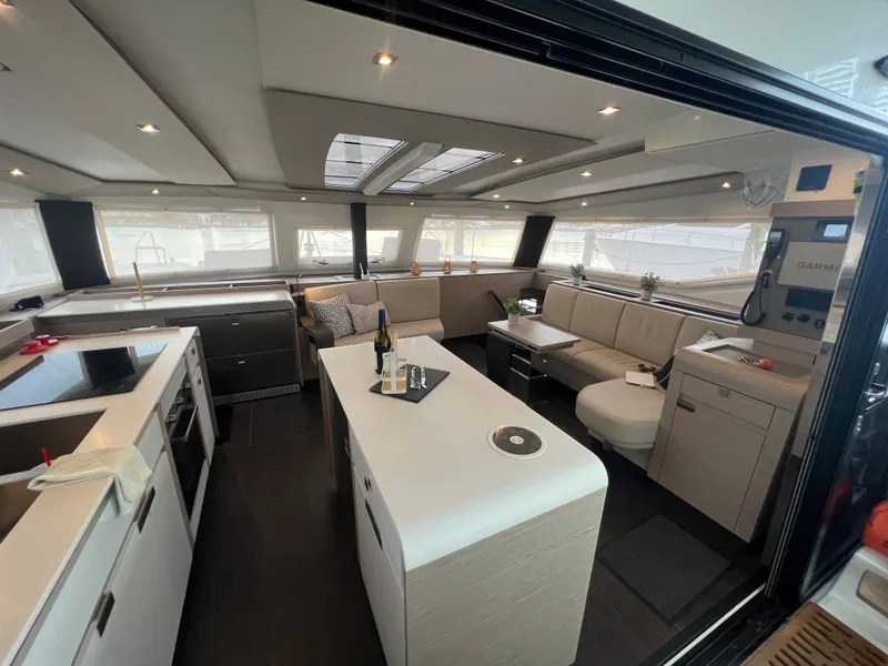 Slide: The Image of Interior of 2022 Fountaine Pajot Aura 51 yacht with modern shelving and fire extinguisher. - 17