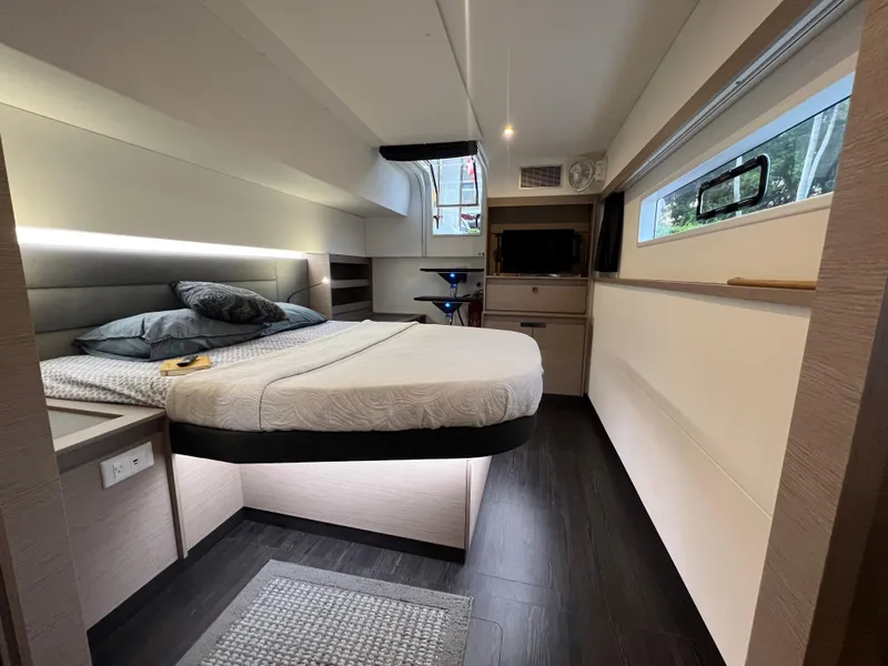 Slide: The Image of Luxurious cabin interior of 2022 Fountaine Pajot Aura 51 yacht, featuring modern design and cozy bedding. - 32