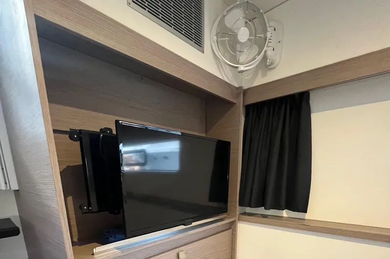 Slide: The Image of Luxurious bedroom interior on 2022 Fountaine Pajot Aura 51 yacht, featuring modern design and ambient lighting. - 35