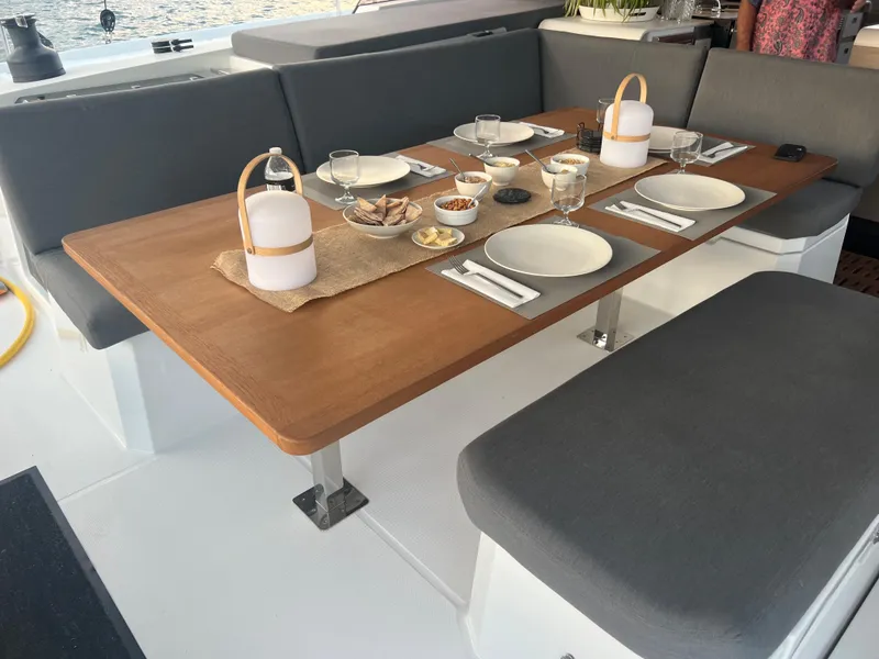 Slide: The Image of Luxurious interior of 2022 Fountaine Pajot Aura 51 catamaran with modern kitchen and seating area. - 9