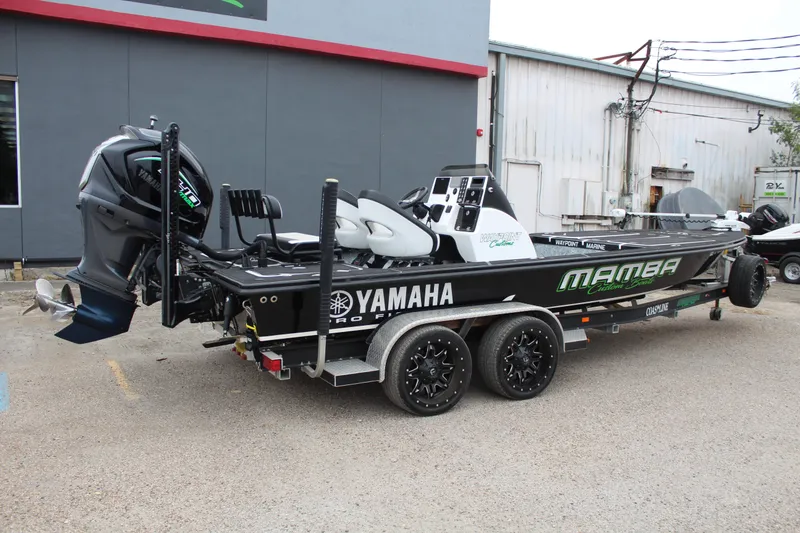 Slide: The Image of 2023 Mamba 227VX boat with custom console and seating, featuring Waypoint Customs branding. - 7