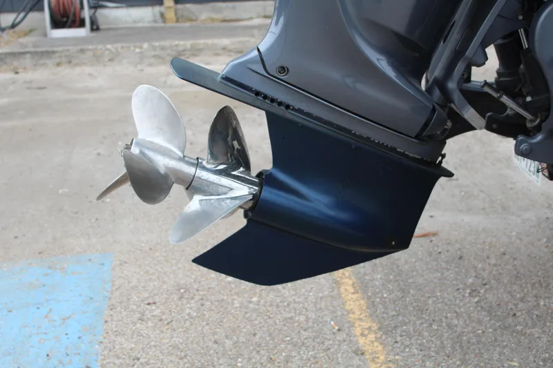 Slide: The Image of 2023 Mamba 227VX boat deck with sleek black design and marine equipment. - 8