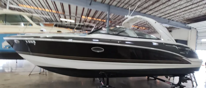 Slide: The Image of 2016 Formula 290 Bowrider boat in a warehouse setting. - 0