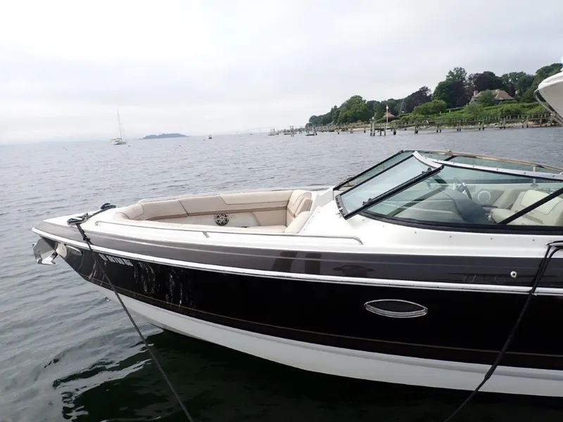 Slide: The Image of 2016 Formula 290 Bowrider on calm water near a scenic shoreline. - 1