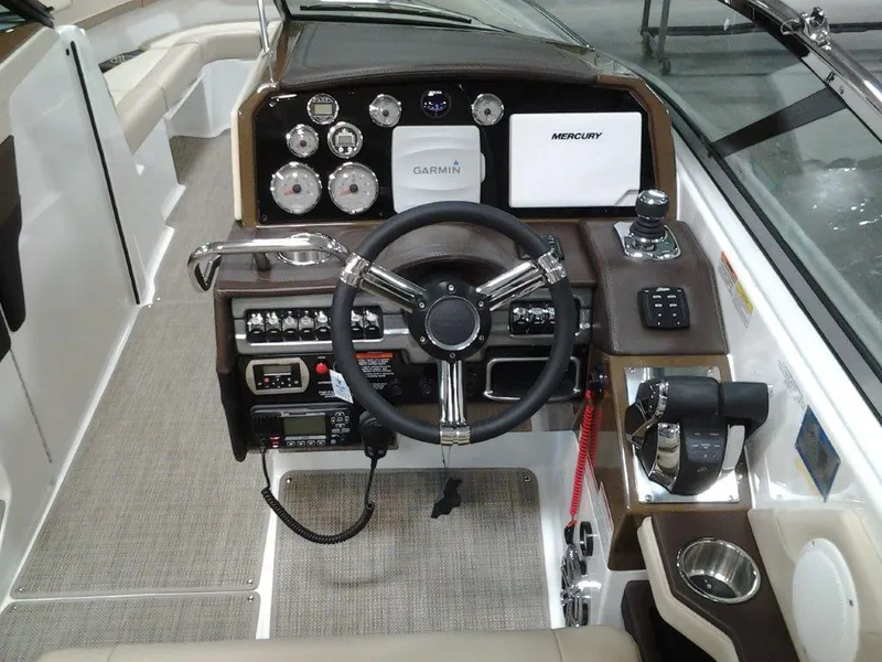 Slide: The Image of 2016 Formula 290 Bowrider dashboard with Garmin and Mercury controls. - 10