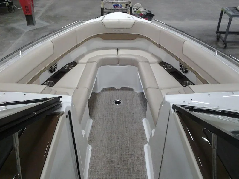 Slide: The Image of 2016 Formula 290 Bowrider interior with beige seating and carpeted floor. - 11