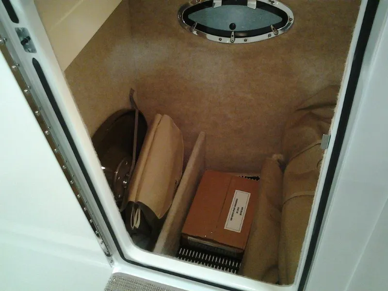 Slide: The Image of 2016 Formula 290 Bowrider cabin storage with porthole and equipment. - 14