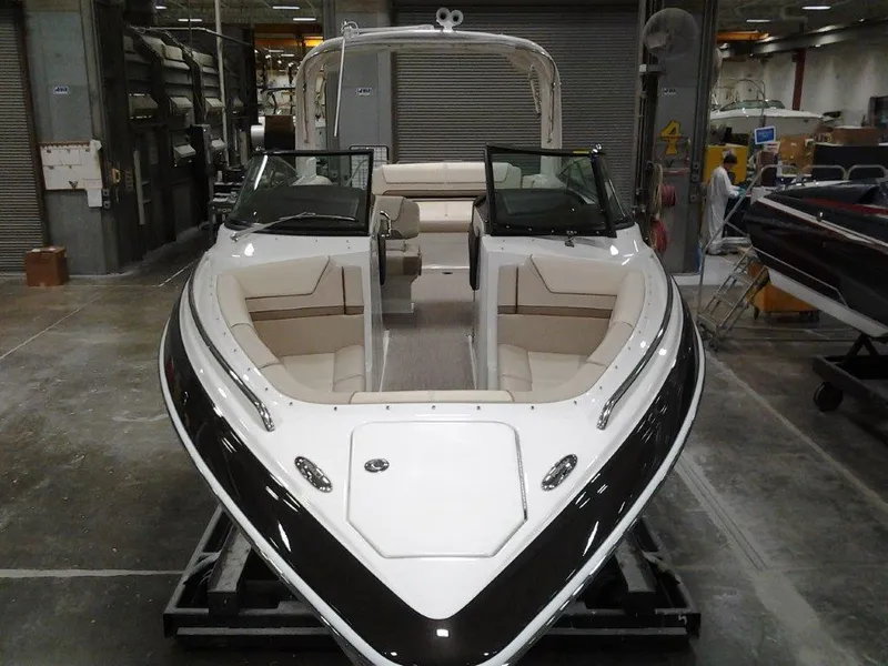 Slide: The Image of 2016 Formula 290 Bowrider boat in a warehouse setting. - 2