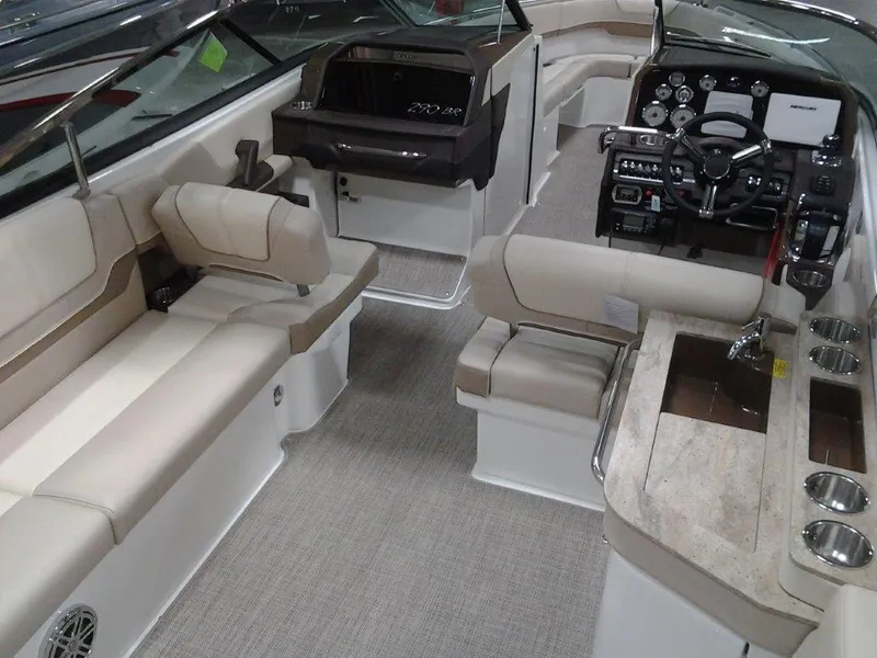 Slide: The Image of 2016 Formula 290 Bowrider interior with beige seating and modern dashboard. - 5