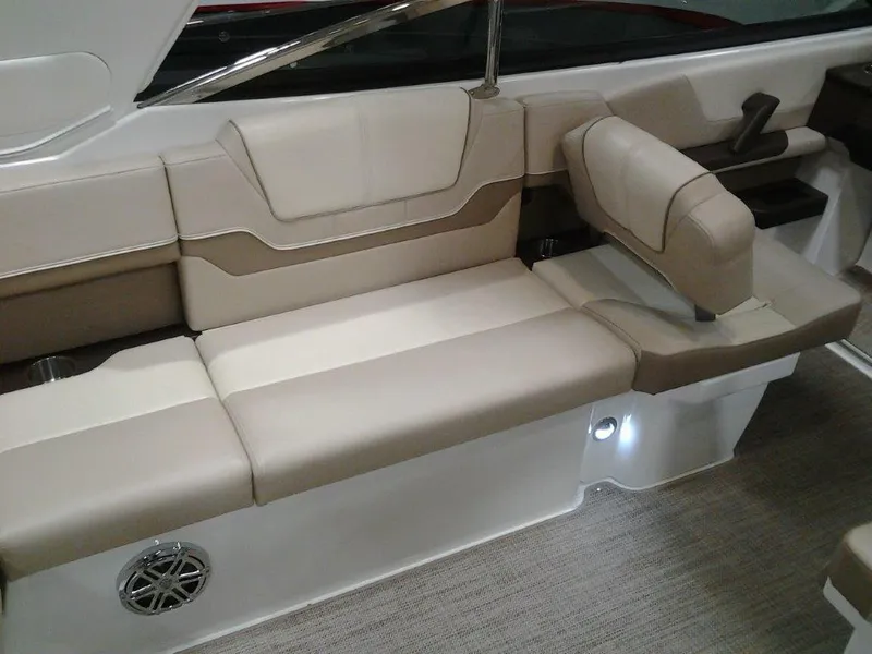 Slide: The Image of 2016 Formula 290 Bowrider interior seating with beige upholstery and speaker. - 7
