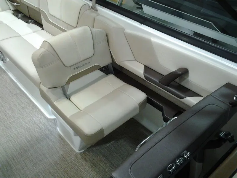 Slide: The Image of 2016 Formula 290 Bowrider interior with beige seating and armrest. - 8