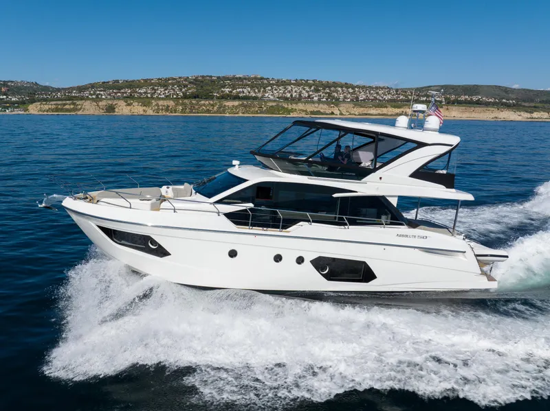 Slide: The Image of 2021 Absolute 50 Fly yacht cruising on open water. - 2