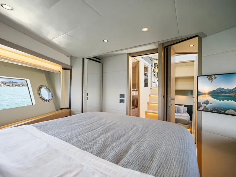 Slide: The Image of Luxurious bedroom interior of 2021 Absolute 50 Fly yacht with scenic window view. - 47