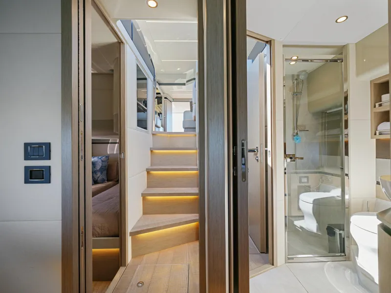 Slide: The Image of Interior of 2021 Absolute 50 Fly yacht with modern design and illuminated stairs. - 49