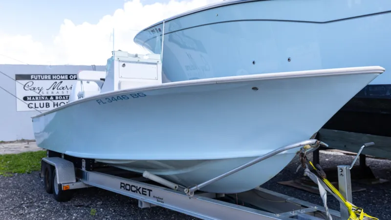Slide: The Image of 1973 SeaCraft 20 boat on trailer at marina, showcasing sleek design and classic style. - 5