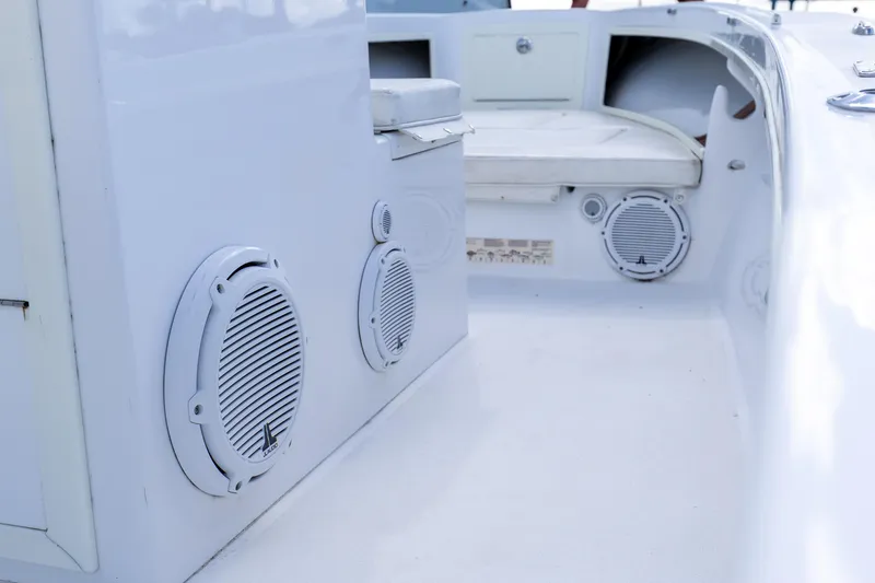 Slide: The Image of 1973 SeaCraft 20 boat interior with white speakers and seating area. - 9