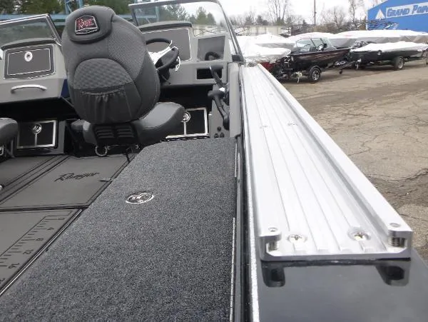 Slide: The Image of 2025 Ranger 622FS Pro boat interior with seating and storage compartments. - 13