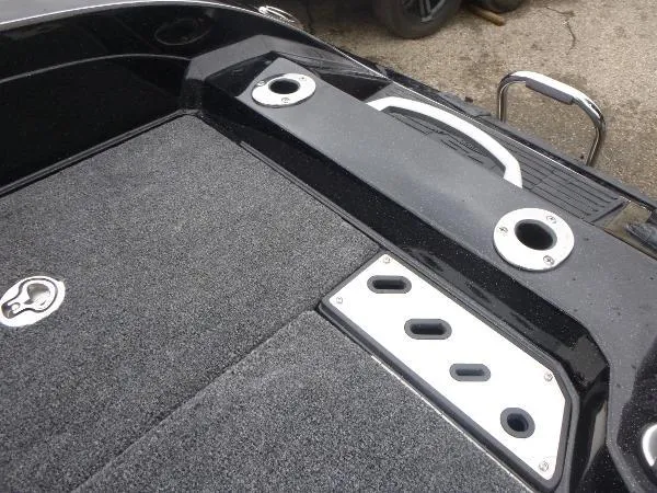 Slide: The Image of 2025 Ranger 622FS Pro boat deck with rod holders and storage compartments. - 16