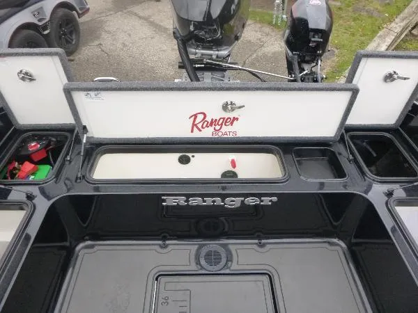 Slide: The Image of 2025 Ranger 622FS Pro boat interior with storage compartments and branding. - 18