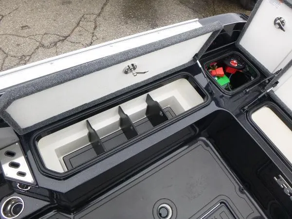 Slide: The Image of 2025 Ranger 622FS Pro boat storage compartments with battery and tackle organizers. - 20