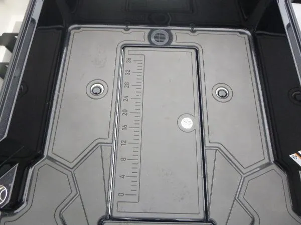 Slide: The Image of 2025 Ranger 622FS Pro boat storage compartment with integrated ruler and drainage system. - 21