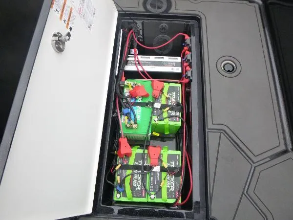 Slide: The Image of Battery compartment of 2025 Ranger 622FS Pro boat with multiple batteries and wiring. - 22