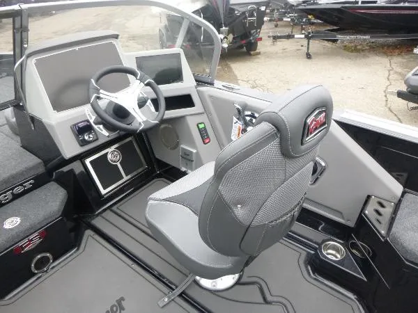 Slide: The Image of 2025 Ranger 622FS Pro boat interior with steering wheel and captain's chair. - 23
