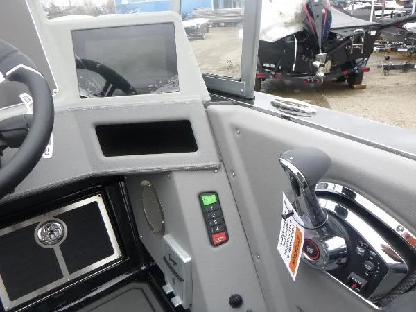 Slide: The Image of 2025 Ranger 622FS Pro boat dashboard with control panel and steering wheel. - 25