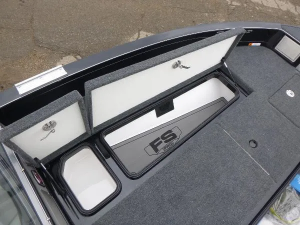 Slide: The Image of 2025 Ranger 622FS Pro boat storage compartments with open lids, showcasing interior design. - 34