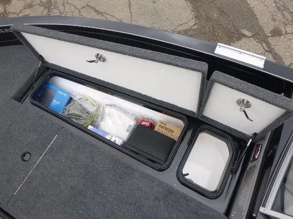 Slide: The Image of 2025 Ranger 622FS Pro boat storage compartments with organized gear and equipment. - 35